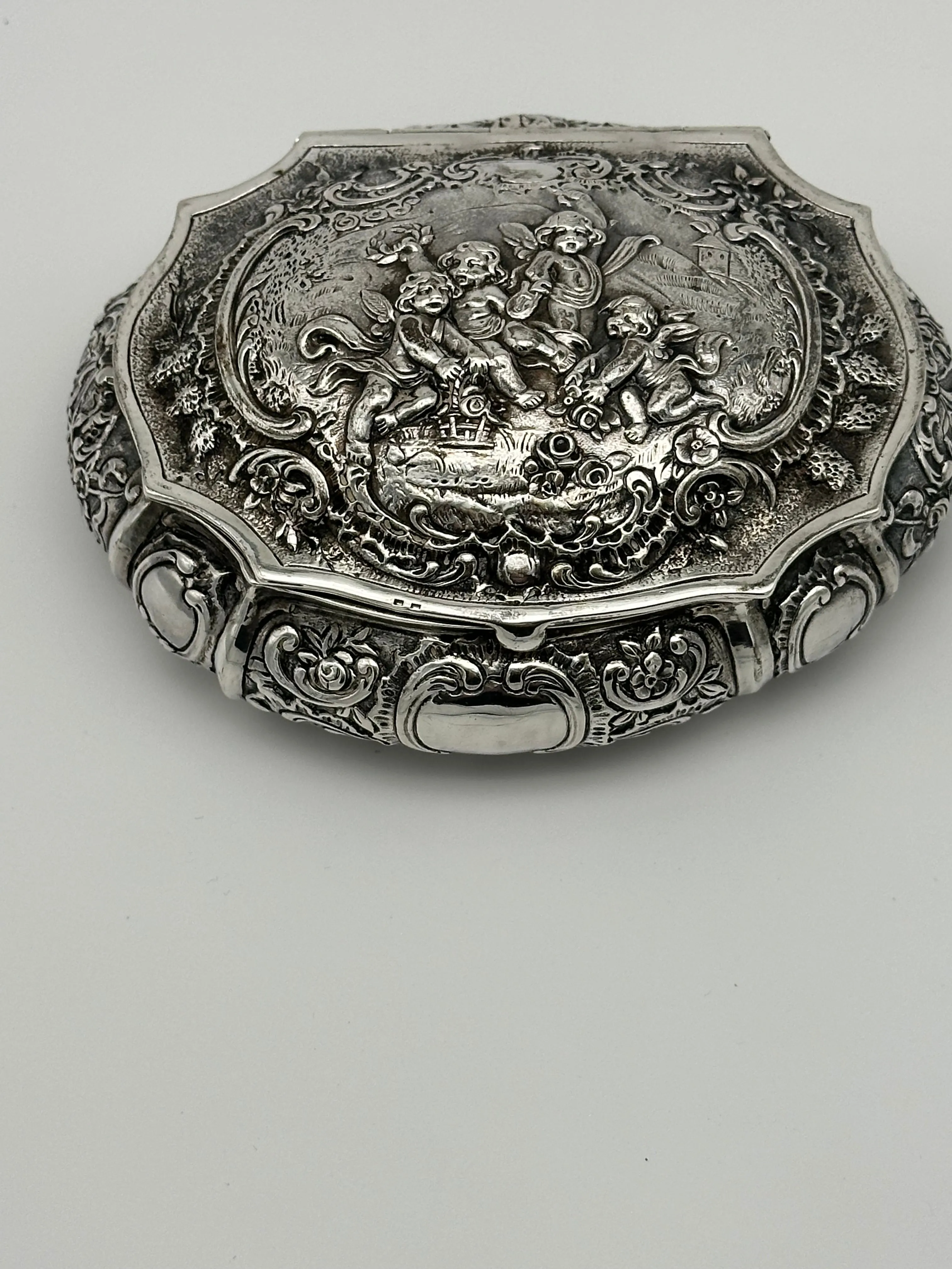 German 800 Silver Repousse Box. Cherubs and Flowers. Circa 1890. 4 3/4" x 4"